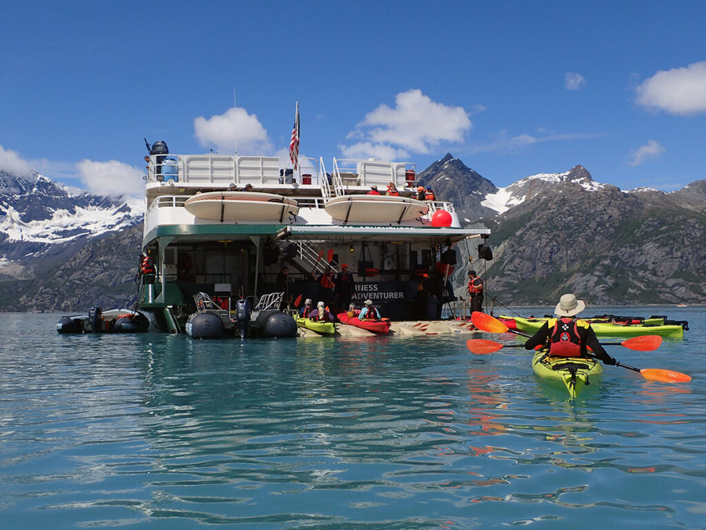 1181x886-AK-Guests-kayaking-Glacier_Bay-return-to-Wilderness-Adventurer